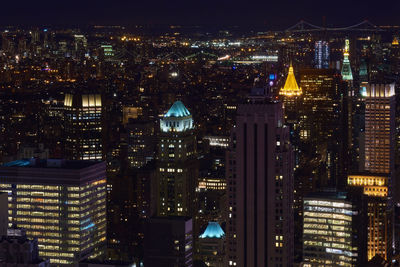 Illuminated buildings in city at night