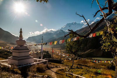 Panoramic shot of buildings and mountains against sky