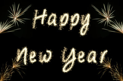 Low angle view of firework display at night