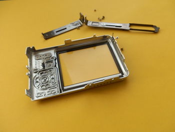 High angle view of equipment on yellow background