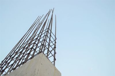 Low angle view of crane against clear sky