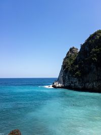 Scenic view of sea against clear blue sky