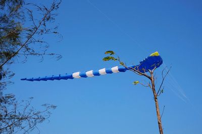 Low angle view of bare tree against blue sky