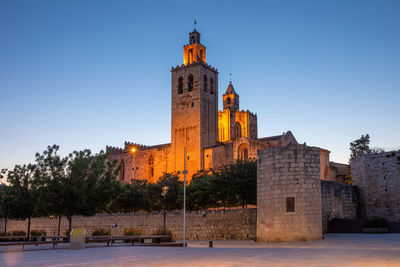 Monastery of sant cugat illuminated at sunset