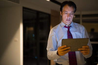 Businessman holding digital tablet at office