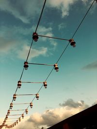 Low angle view of cables against sky