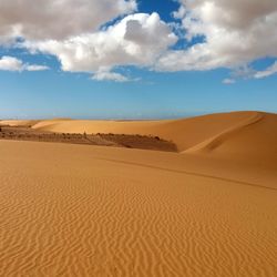 Scenic view of desert against sky