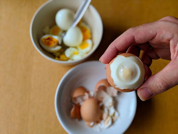 Midsection of person holding breakfast