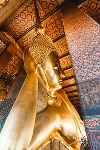 Low angle view of buddha statue in temple