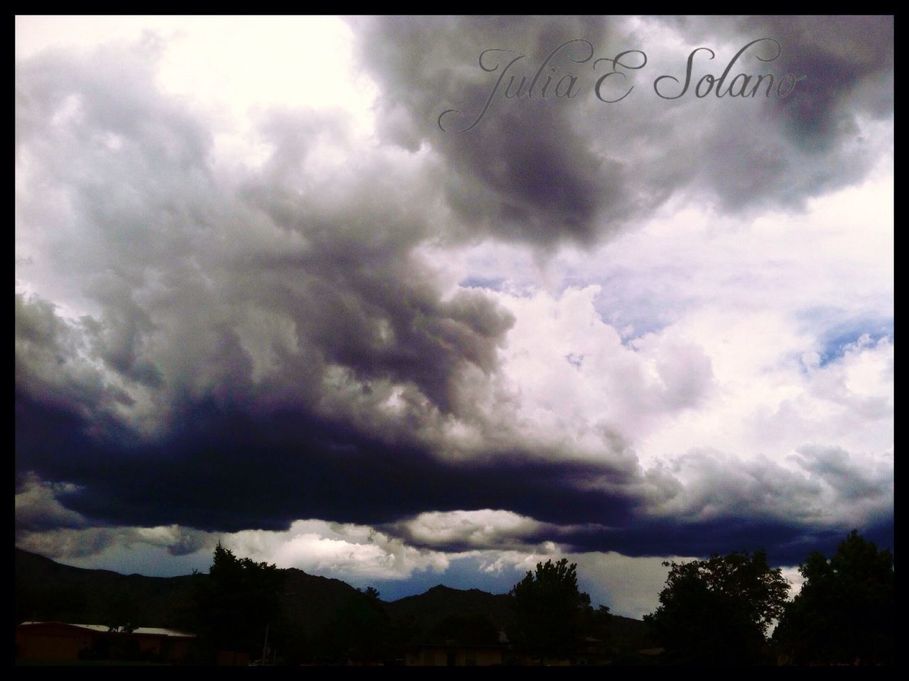 sky, transfer print, cloud - sky, cloudy, weather, auto post production filter, storm cloud, overcast, cloud, scenics, beauty in nature, tranquility, tranquil scene, nature, cloudscape, low angle view, dramatic sky, tree, dusk, silhouette