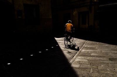 Full length of woman in illuminated city at night