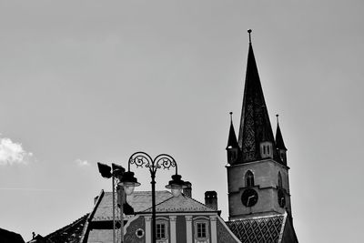 Low angle view of clock tower against sky