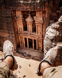 Low section of man against old building