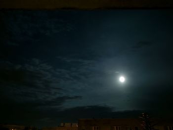 Low angle view of moon in sky at night