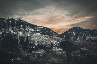 Scenic view of mountains against sky during sunset