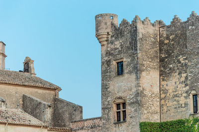 Low angle view of historic building against blue sky