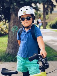 Portrait of boy with bicycle