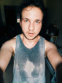 Portrait of young man in darkroom