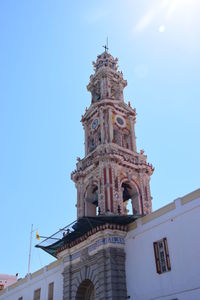 Low angle view of bell tower against sky