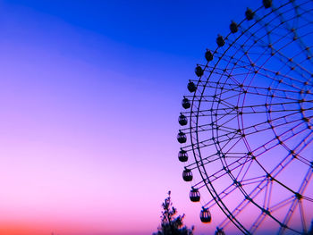 Ferris wheels and colorful sky