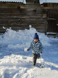 Full length of girl in snow