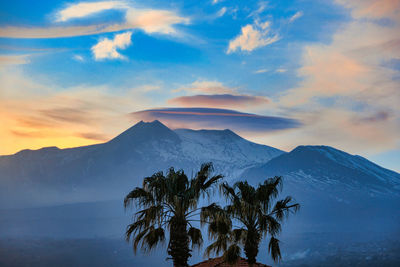 Scenic view of snowcapped volevano etna against sky