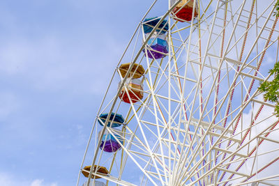 Low angle view of ferris wheel against sky