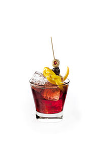 Close-up of drink on glass against white background