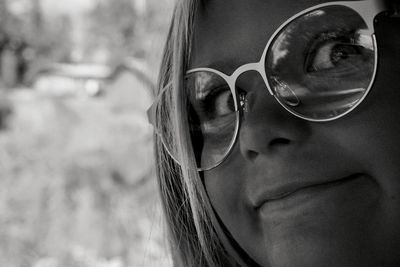 Close-up of young woman wearing sunglasses