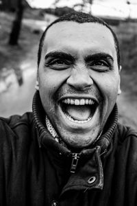 Portrait of excited man shouting