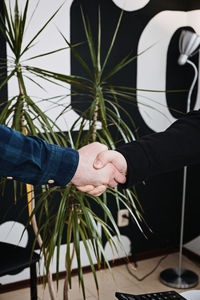 Businessmen people in informal casual clothes shaking hands. client or customer and business owner