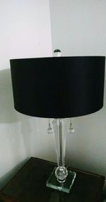 Close-up of illuminated lamp on table at home