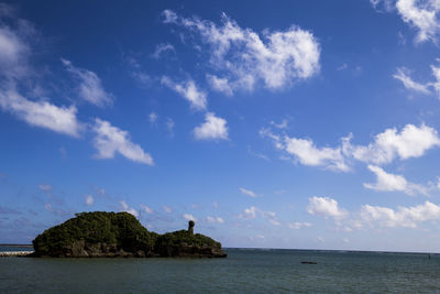 Scenic view of sea against blue sky