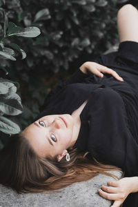 Portrait of young woman lying down