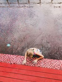 High angle portrait of woman with red umbrella