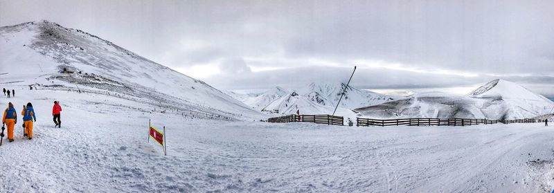 Panoramic view of snowcapped mountain against sky