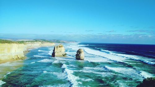 Scenic view of sea against clear blue sky