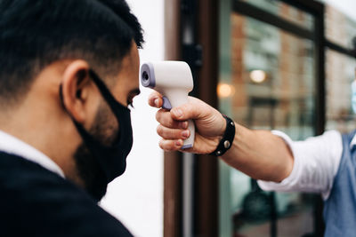 Portrait of man holding camera