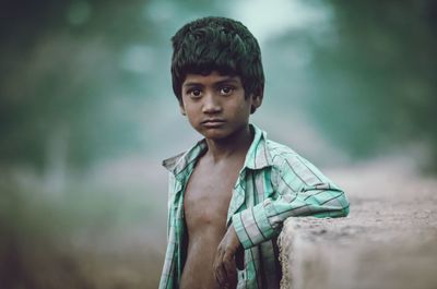 Portrait of young man standing outdoors