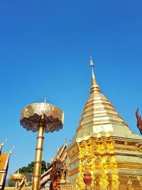 Low angle view of traditional building against blue sky