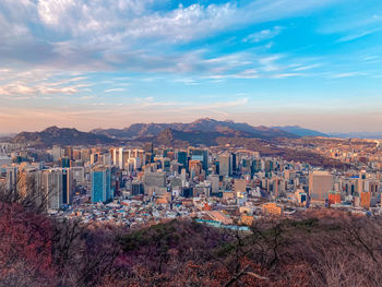 High angle view of cityscape against sky during sunset