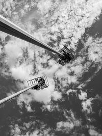 Low angle view of amusement park ride against sky