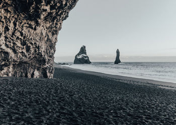 Dramatic landscape in iceland- black beach in vik.