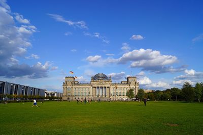 People in front of historical building