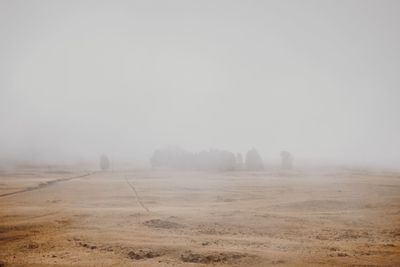 Landscape against sky during foggy weather