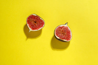 Close-up of fruits on yellow background