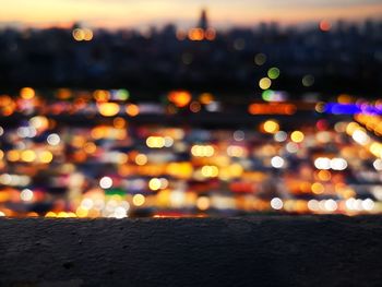 Defocused image of illuminated city at night