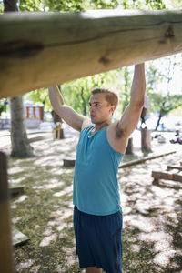 Determined man exercising at outdoor health club
