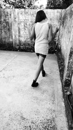 Rear view of woman playing