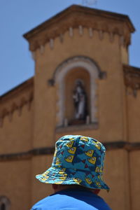 Low angle view of cross against sky